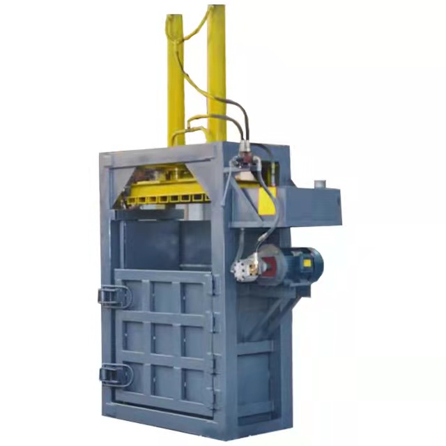 Hydraulic vertical baler machine for waste paper carton
